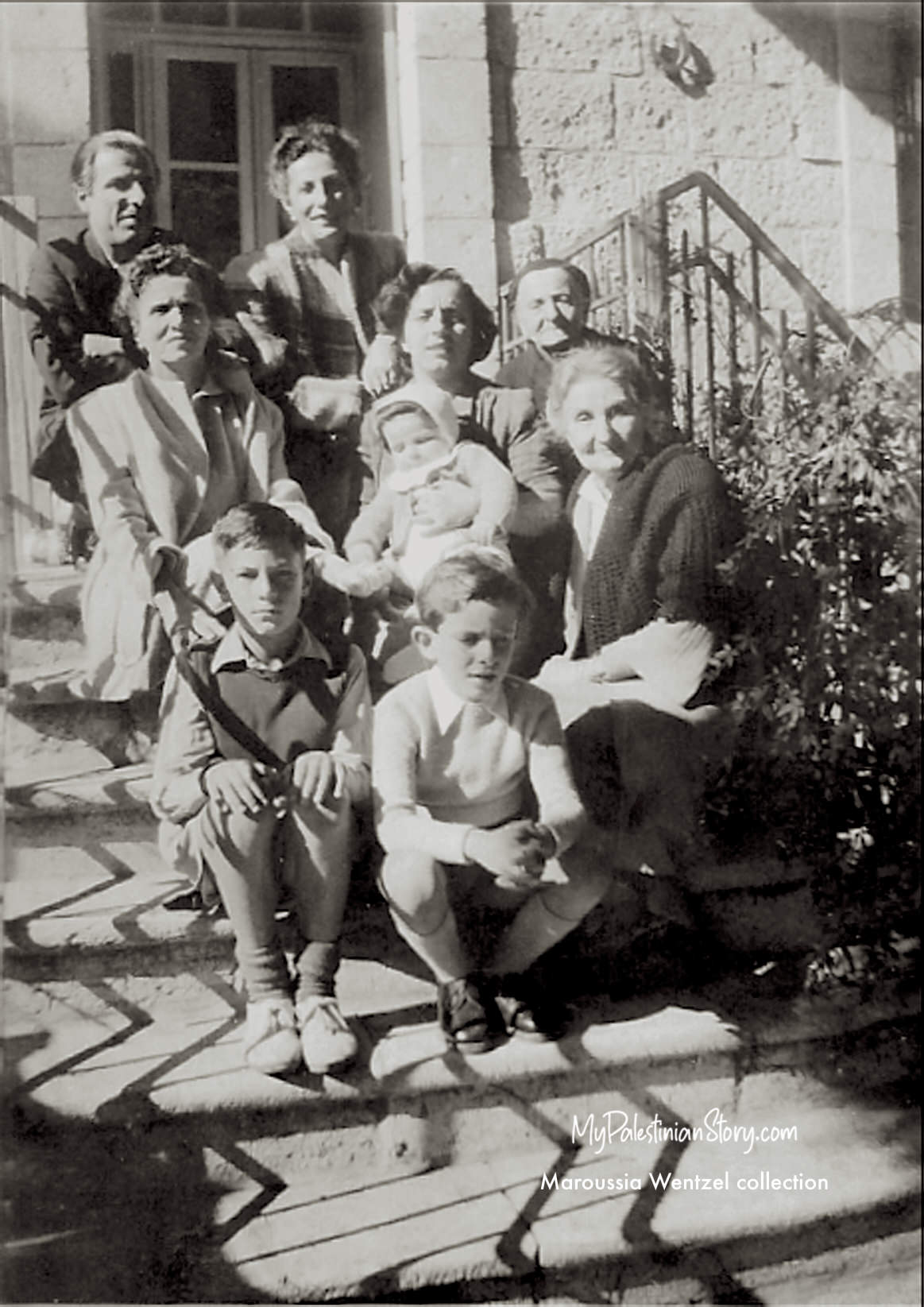 On the steps of the Gaitanopoulos house. Top row: Marika on the right. Middle row: Anna on the left, Kalliope on the right. Bottom row: John on the left, Erifeely on the right - Jerusalem, mid 1940s